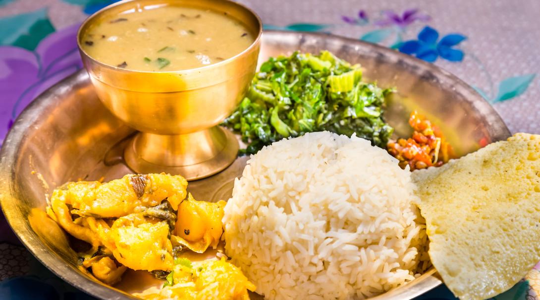 A traditional Nepali dish called Dal Bhat. A combination of rice, veggies, and lentil soup