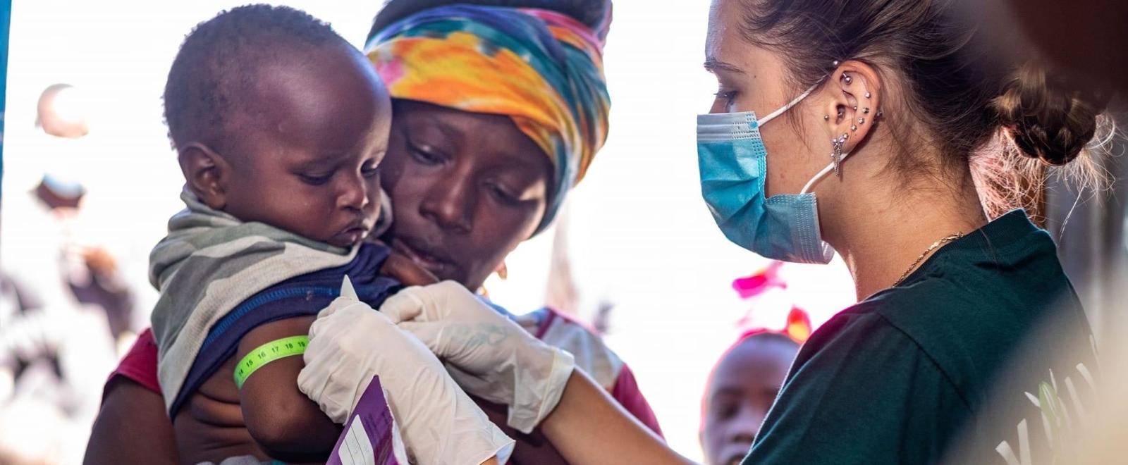 Medical intern Devon giving care to a child