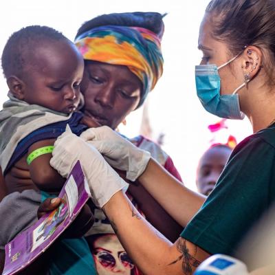 Medical intern Devon giving care to a child