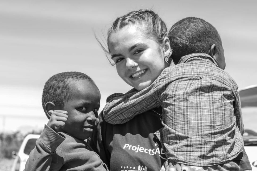 Medical volunteer with children on a volunteer project