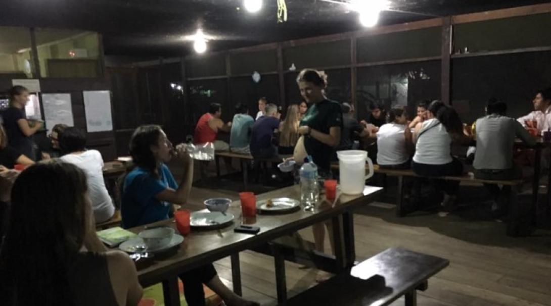 Volunteers eating in the dining room