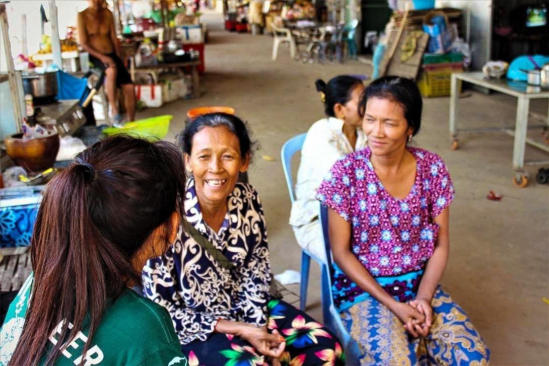 Projects Abroad Microfinance coordinator sits down to discuss with new beneficiaries on Silk Island