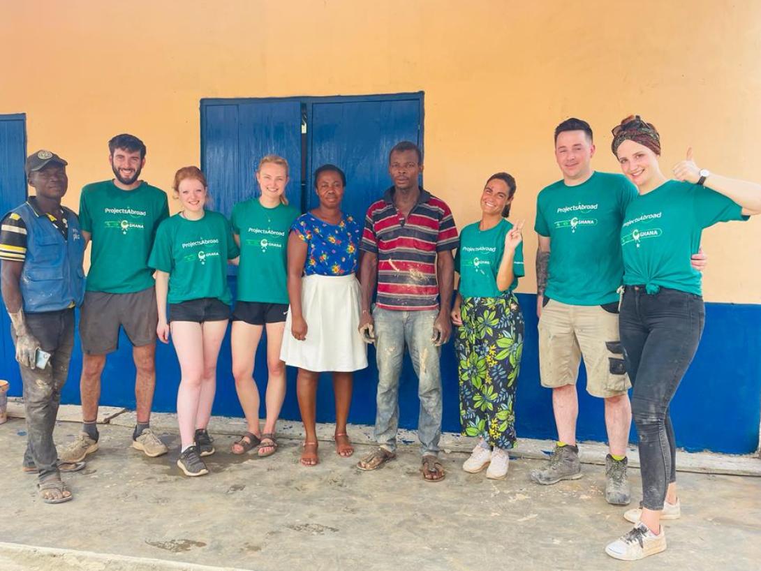 Volunteers celebrate the completion of a new classroom in Akuapem Hills. 