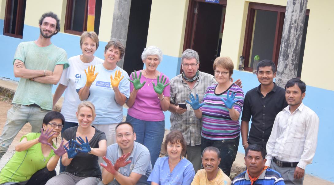 A group of Grown-up Special volunteers finish painting