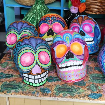 A sugar skull hand painted and on sale at a market in Mexico.