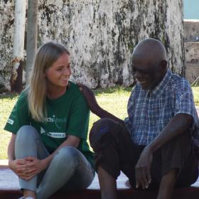 A psychology intern abroad has a friendly conversation with a local man. 