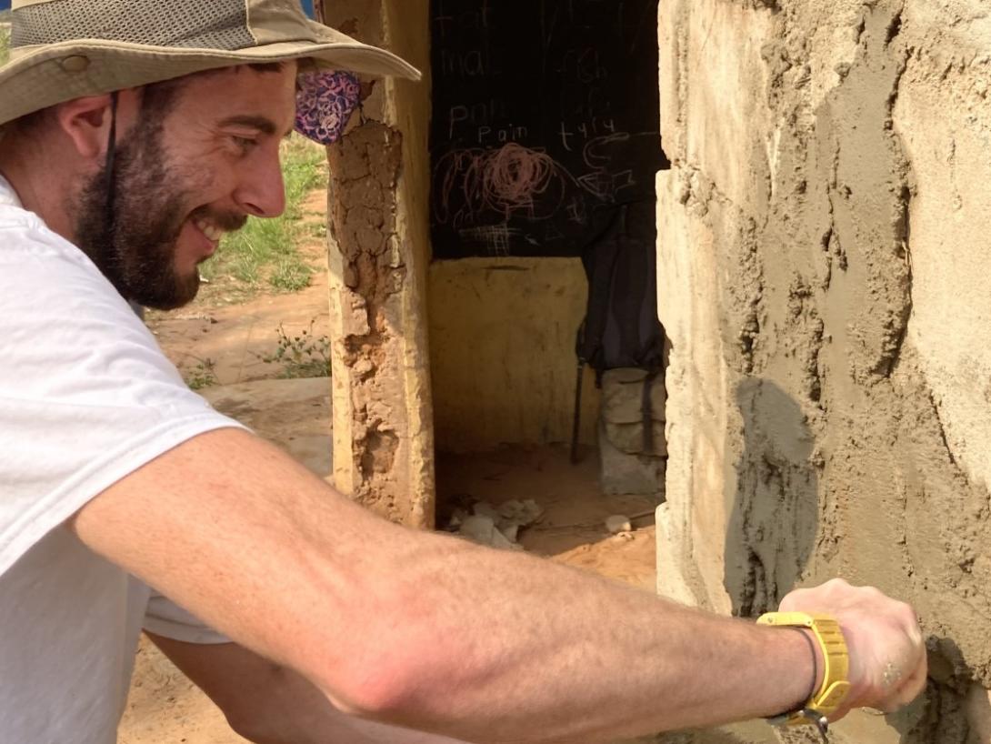 Joel plastering the classroom wall