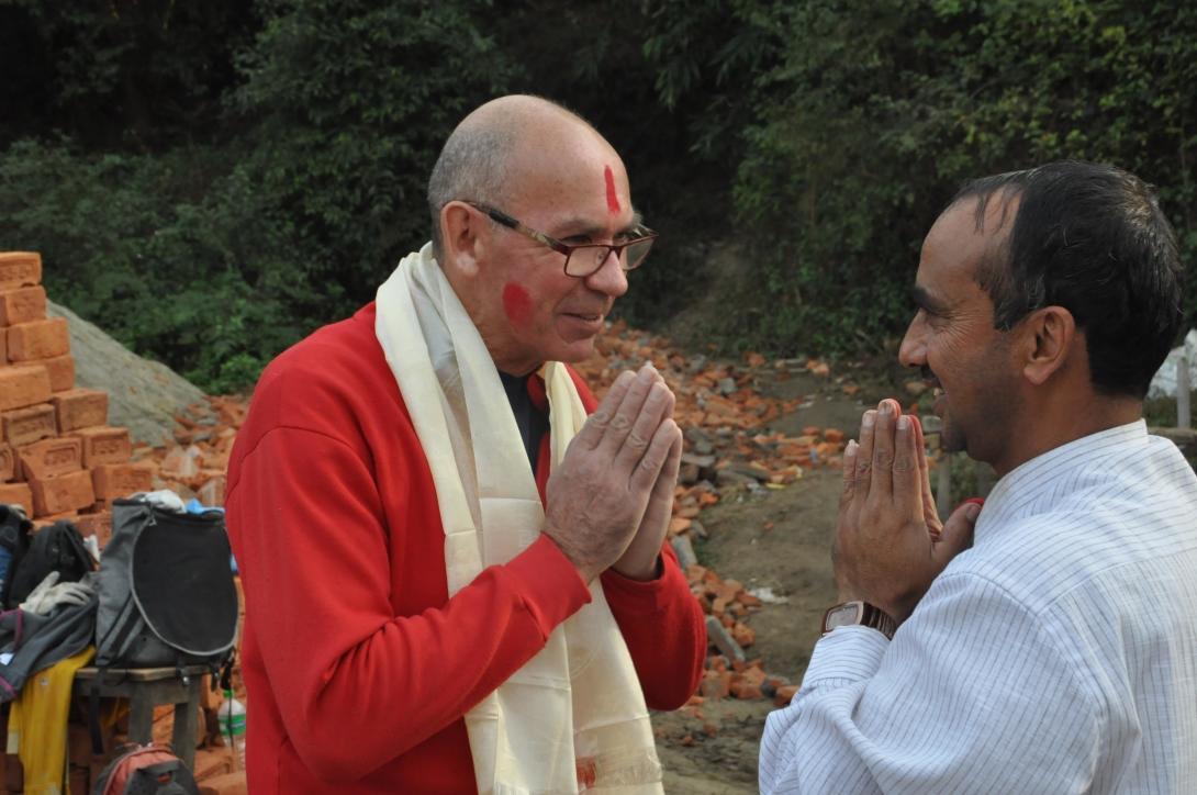 A local staff member presents a volunteer with a khata in Nepal.