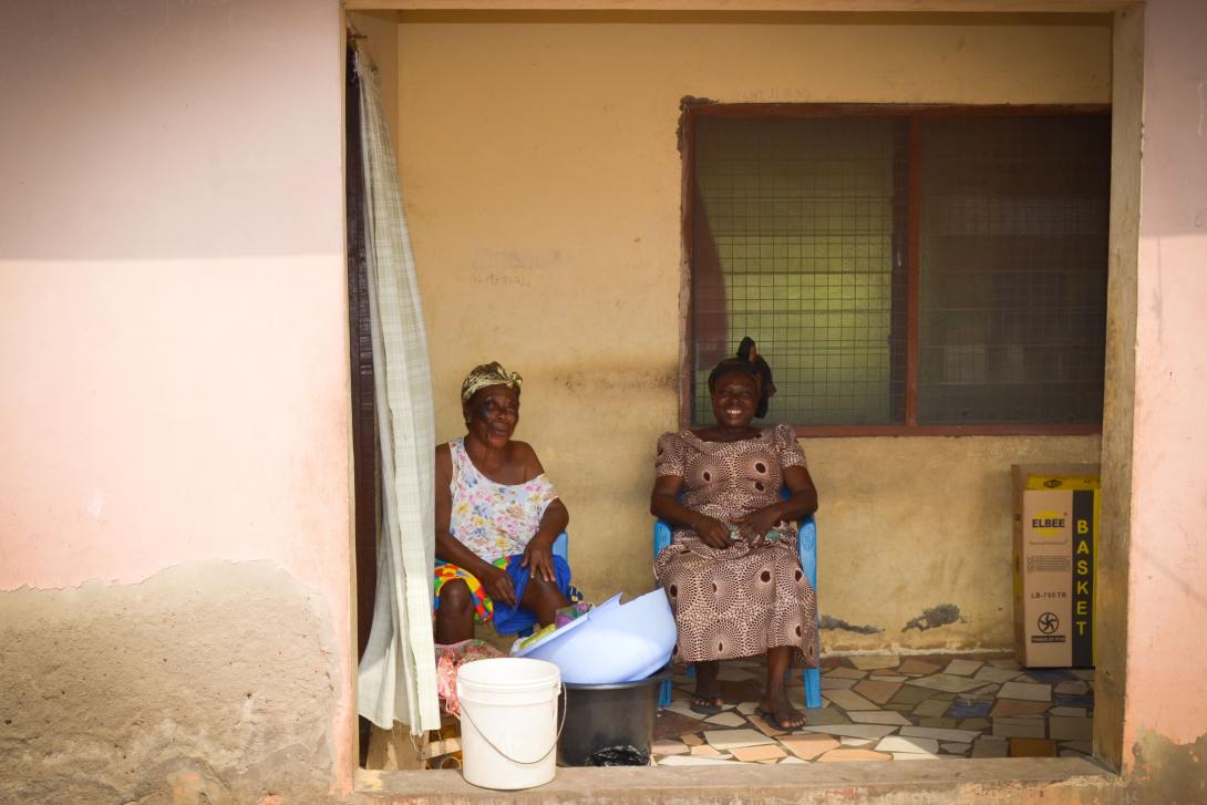 Local Ghanaian women smile at photographer