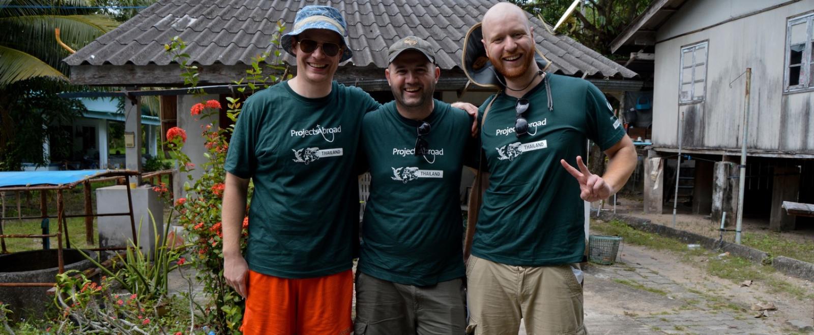 Three older volunteers enjoying themselves on their gap year in Thailand