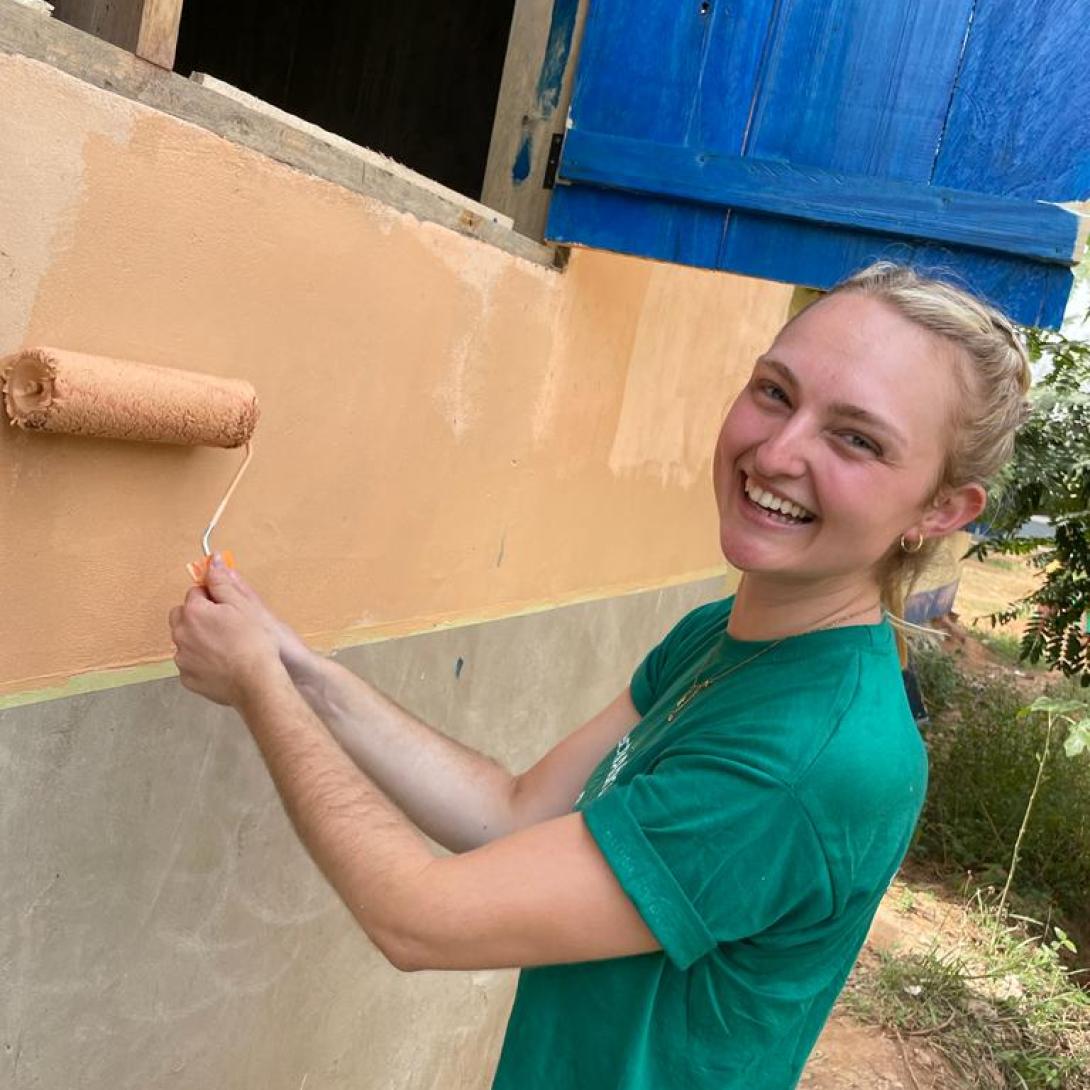 Volunteer painting a new classroom