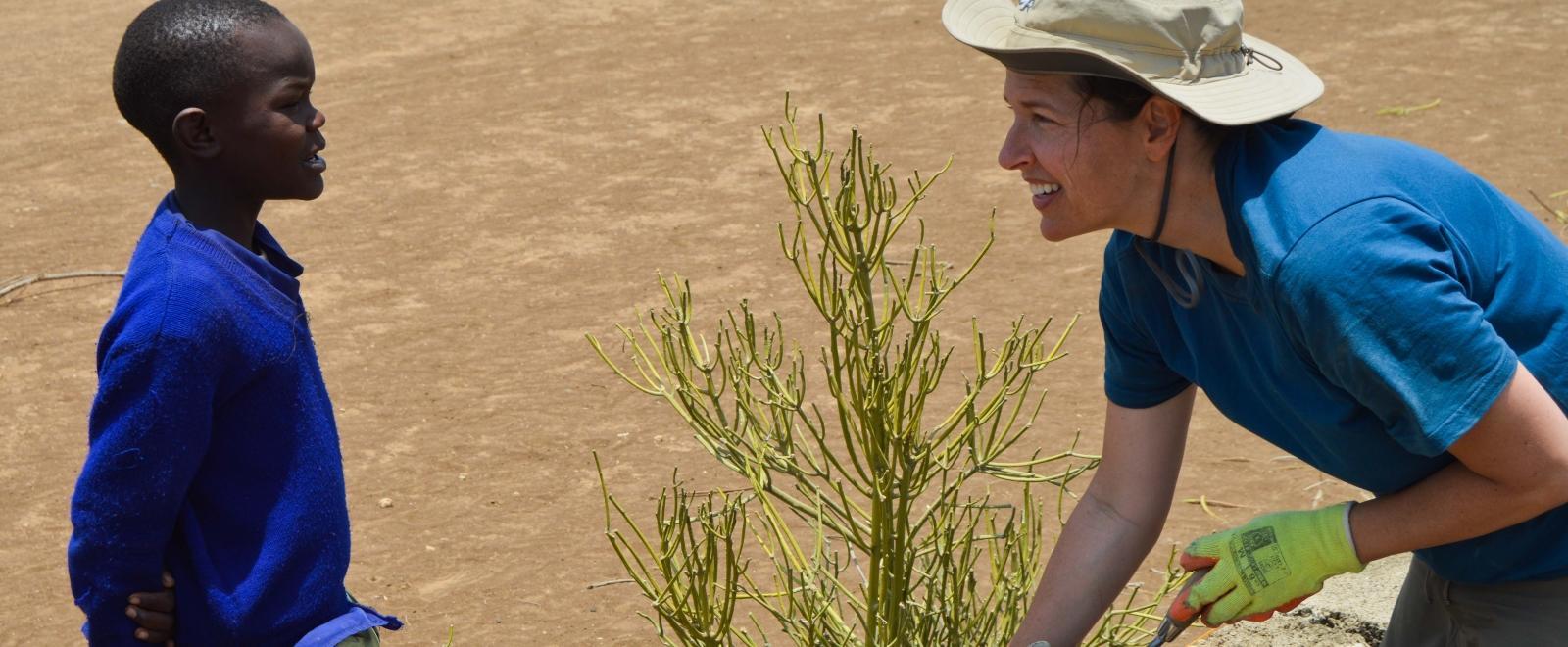 Projects Abroad volunteer helps to build a wall during her construction volunteer work in Tanzania