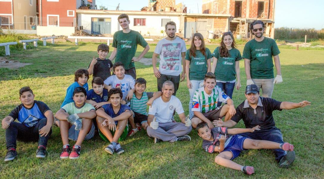 Players and coaches pose for a photo during their volunteer sports coaching in Argentina