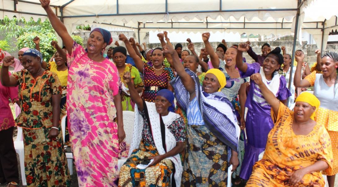 Local women attend an International Women's Day presentation delivered on the Human Rights internship in Tanzania.