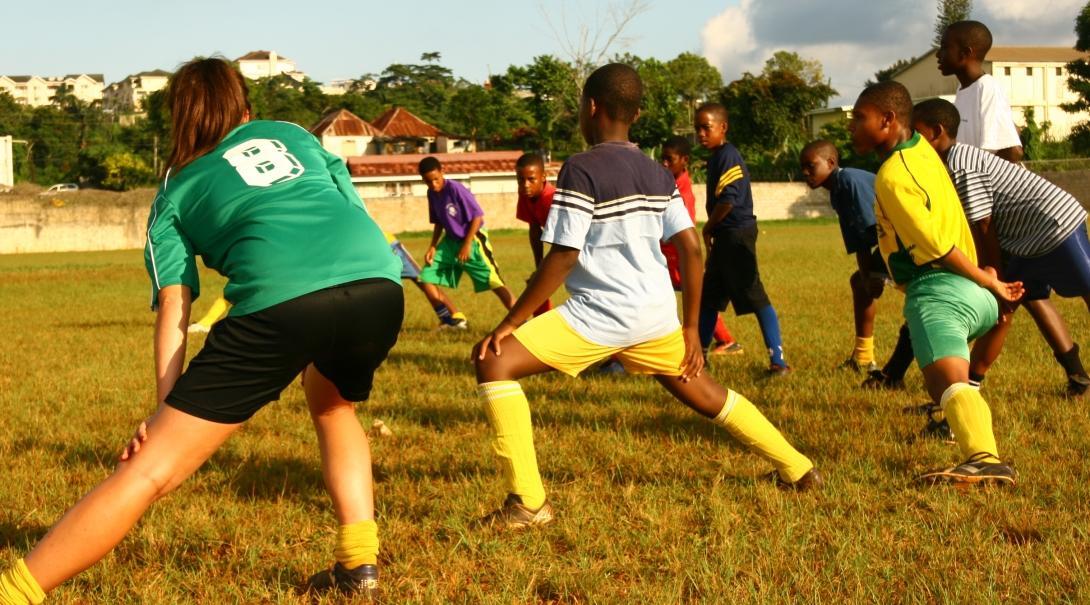 A volunteer taking football classes gains sports coaching work experience in Jamaica