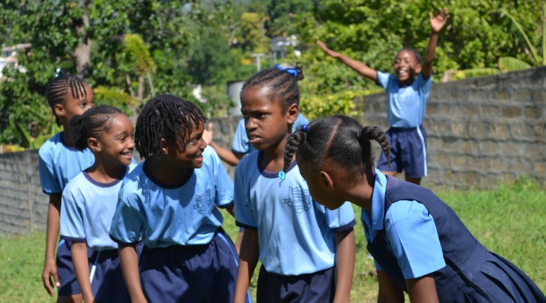 A physical education teacher gives lessons while volunteering as a sports coach in schools in Jamaica