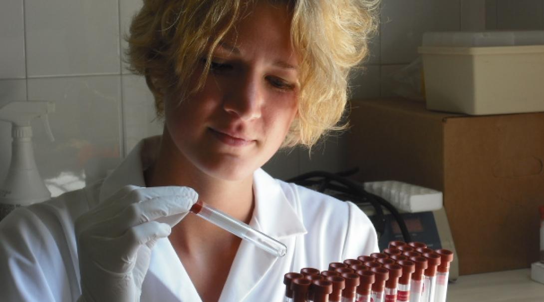 Projects Abroad Medicine intern with a tray of test tubes during her Medicine internship in Jamaica.