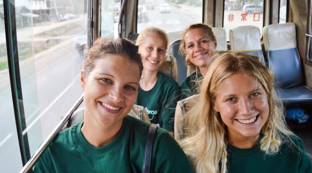 Two teenage volunteers prepare for their work with children in Tanzania