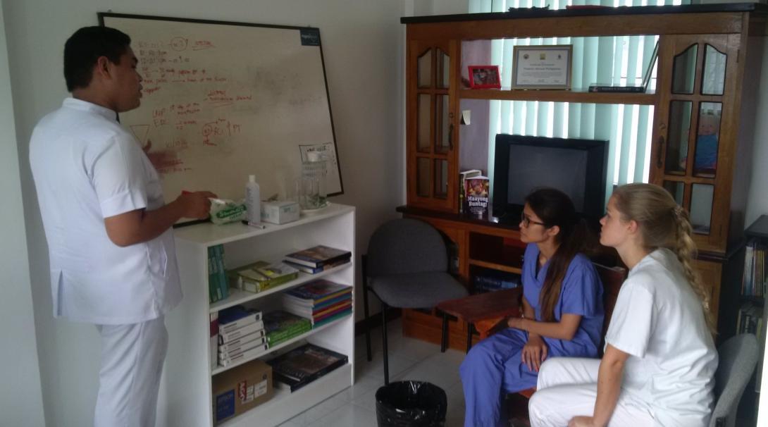 Interns are pictured learning about vital signs with a local doctor whilst on their medical internship in the Phillippines.