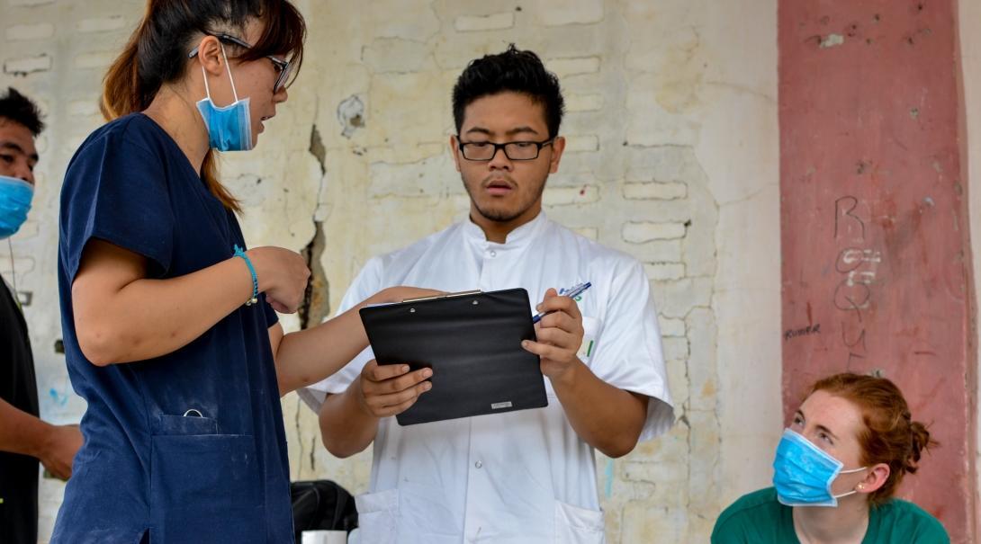 Interns pictured working together with local doctors during their medical internship in the Phillippines with Projects Abroad.