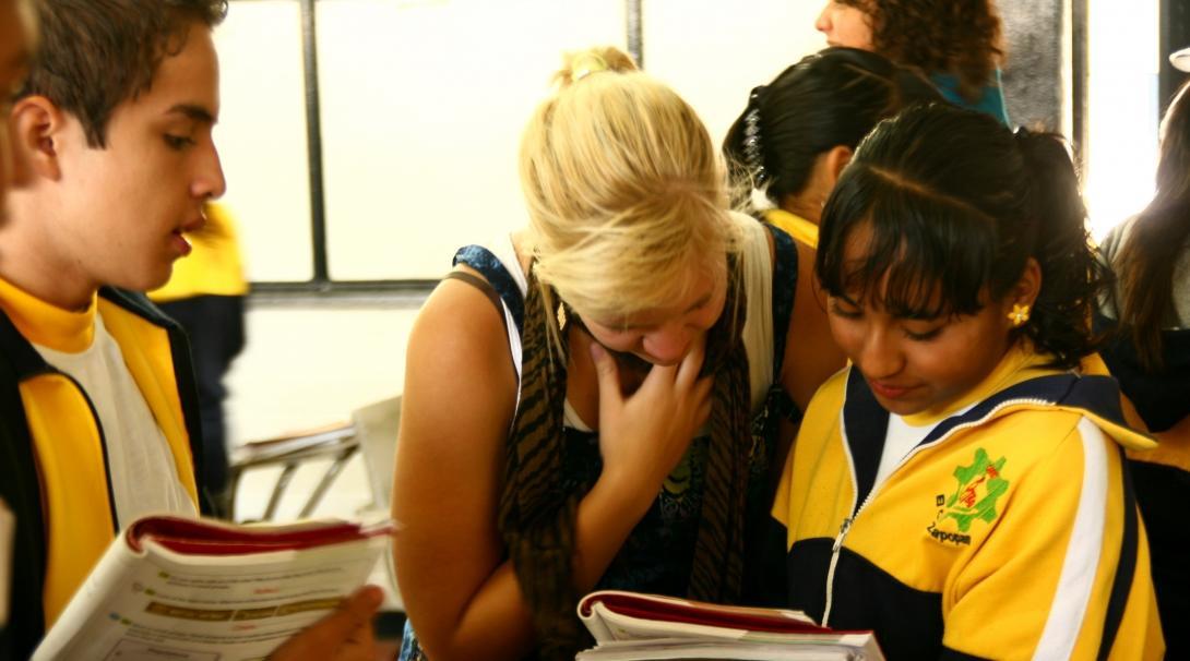 A student studying Spanish in Mexico with Projects Abroad volunteers in a local school with young children.  