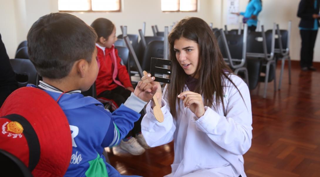 A child being assessed through Projects Abroad's medical internship for high school students in Peru