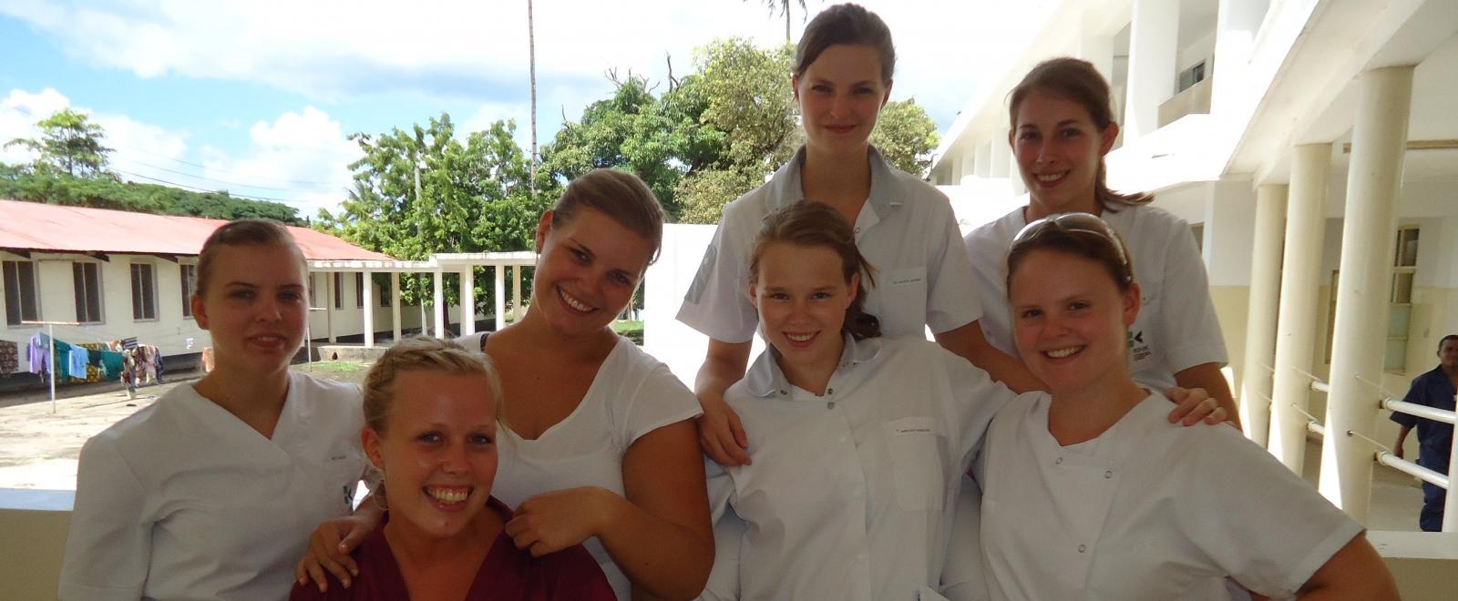 Projects Abroad Dentistry interns pose with a local healthcare staff member during their Dentistry placement in Tanzania.