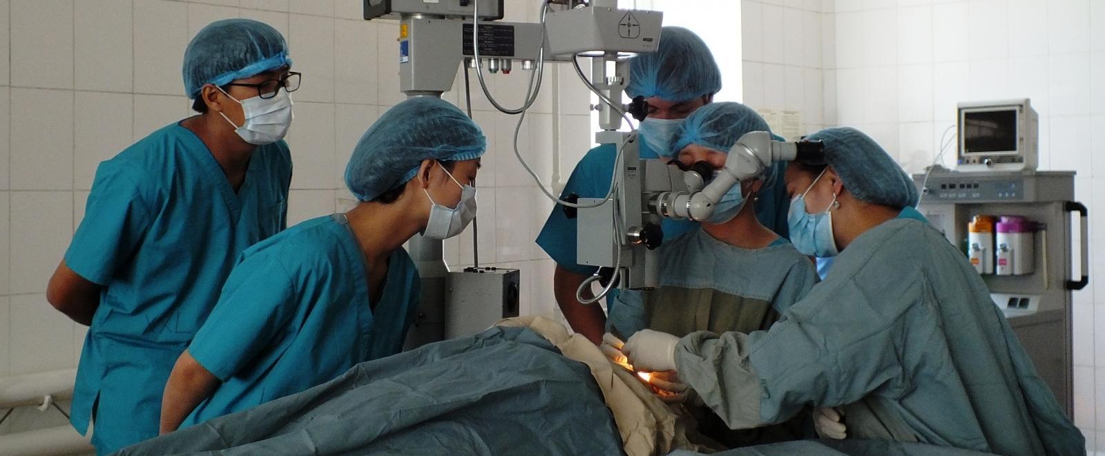 Medical interns observe a medical procedure in a hospital as part of their work experience in Mongolia. 