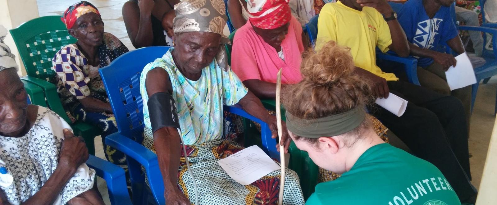 A teenager measures blood pressure during our medical internship in Ghana