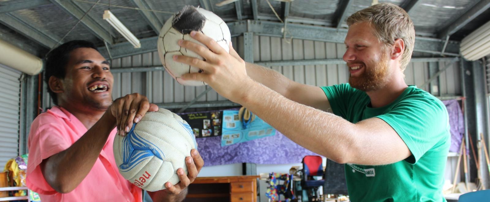 A graduate doing a Physiotherapy internship abroad works with a patient during a treatment session in Samoa.