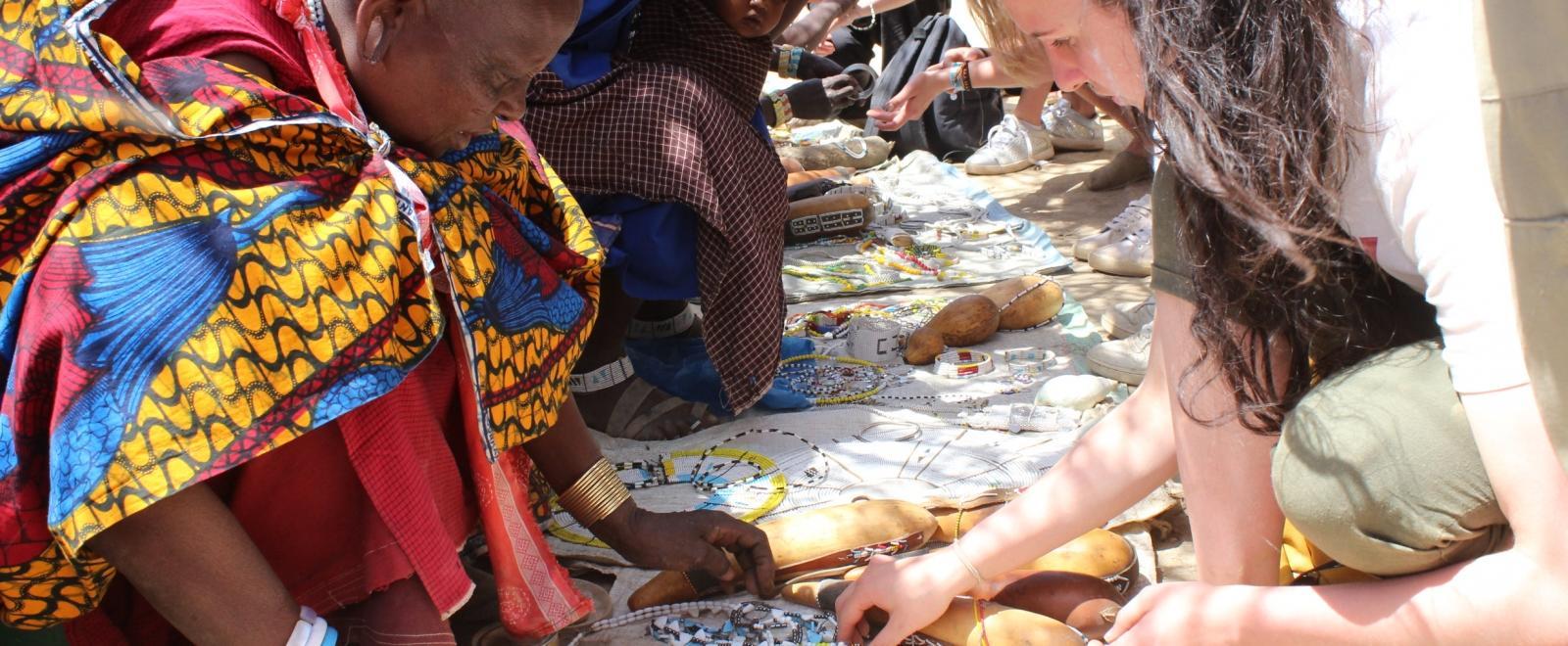 A volunteer looking at beaded jewellery during a Projects Abroad cultural exchange programme abroad. 