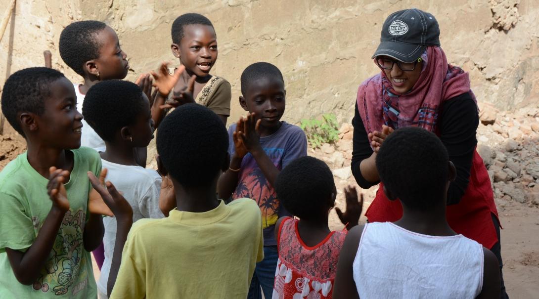 An intern working with a group of children and gaining social work experience in Ghana. 