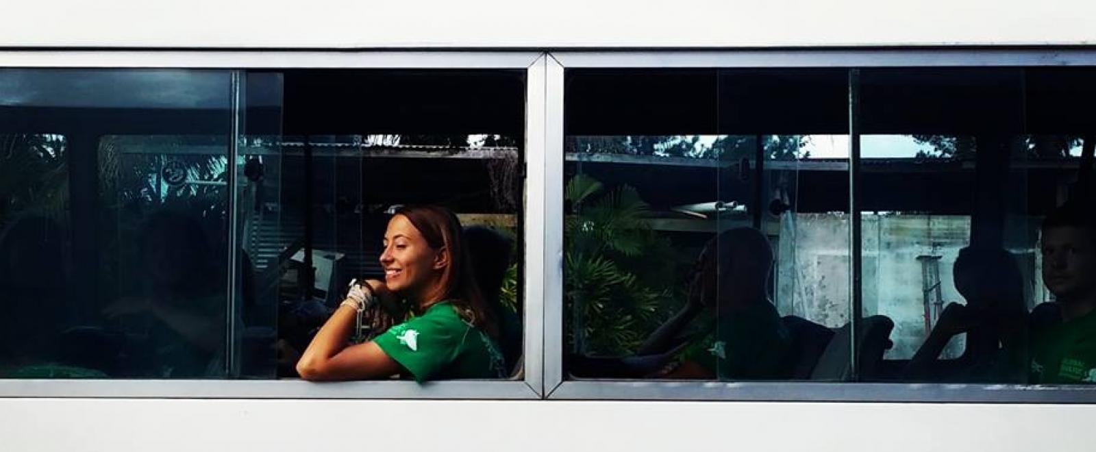 Volunteer travelling in a minibus