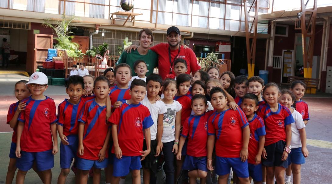 A volunteer poses with his team on a sports placement in Costa Rica