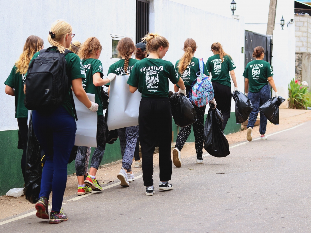 As a part of their medical projects abroad, high school students raise awareness of dengue fever and pick up litter to reduce possible mosquito breeding grounds.