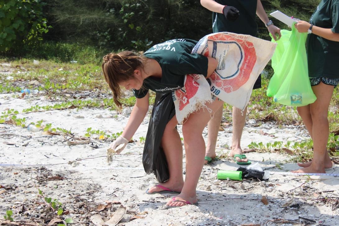 Conservation volunteer cleaning the beach