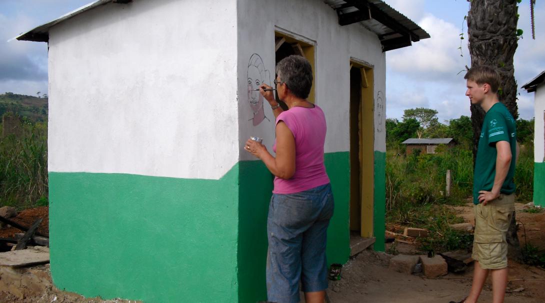 Painting fun and educational murals is part of building volunteer work in Ghana.