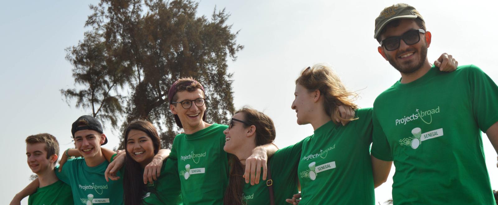 Group of volunteers smiling and enjoying their project abroad