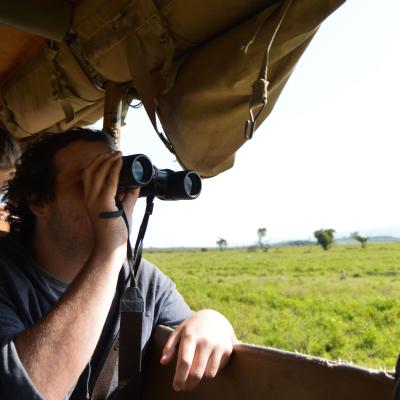 Conservation intern spots a giraffe during his wildlife survey in Kenya.