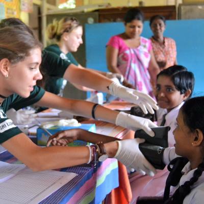 Students on a medical school gap year program work at an outreach in Sri Lanka.