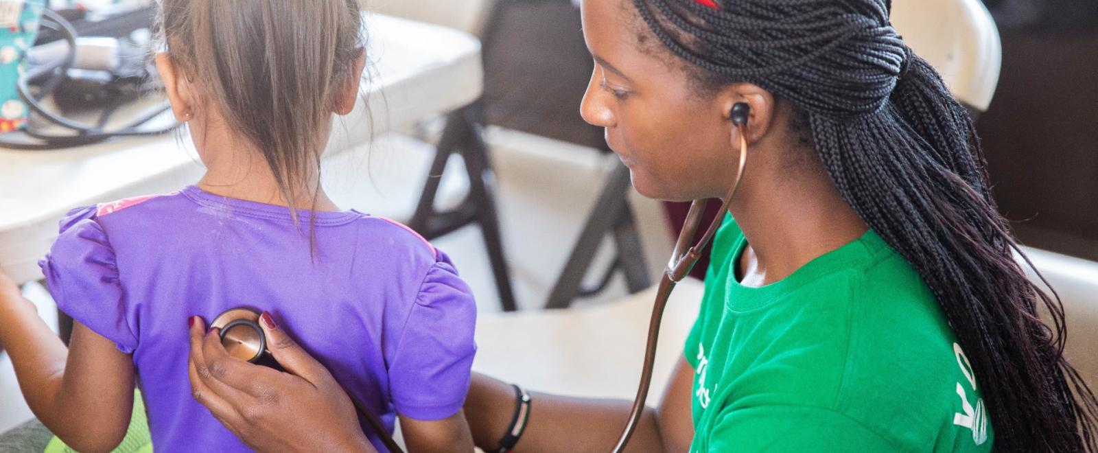 Volunteer providing a health check in Peru