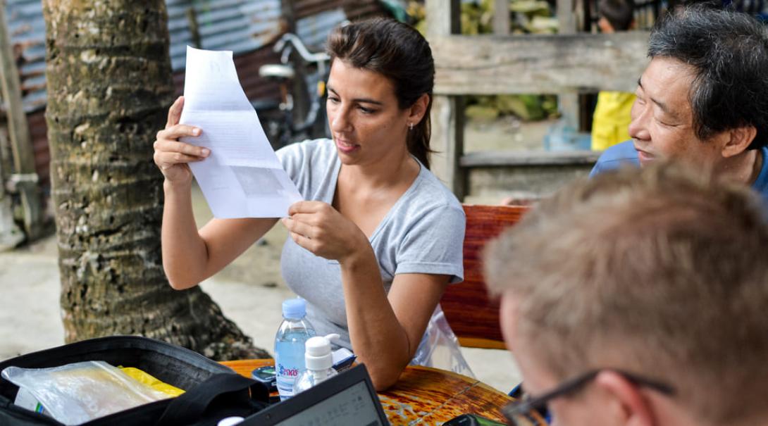 A Medical intern checks data in Cambodia