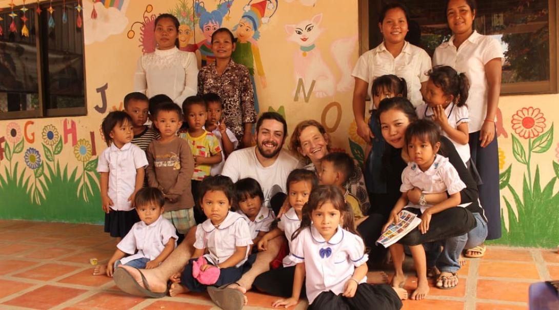 Interns with school children in Cambodia