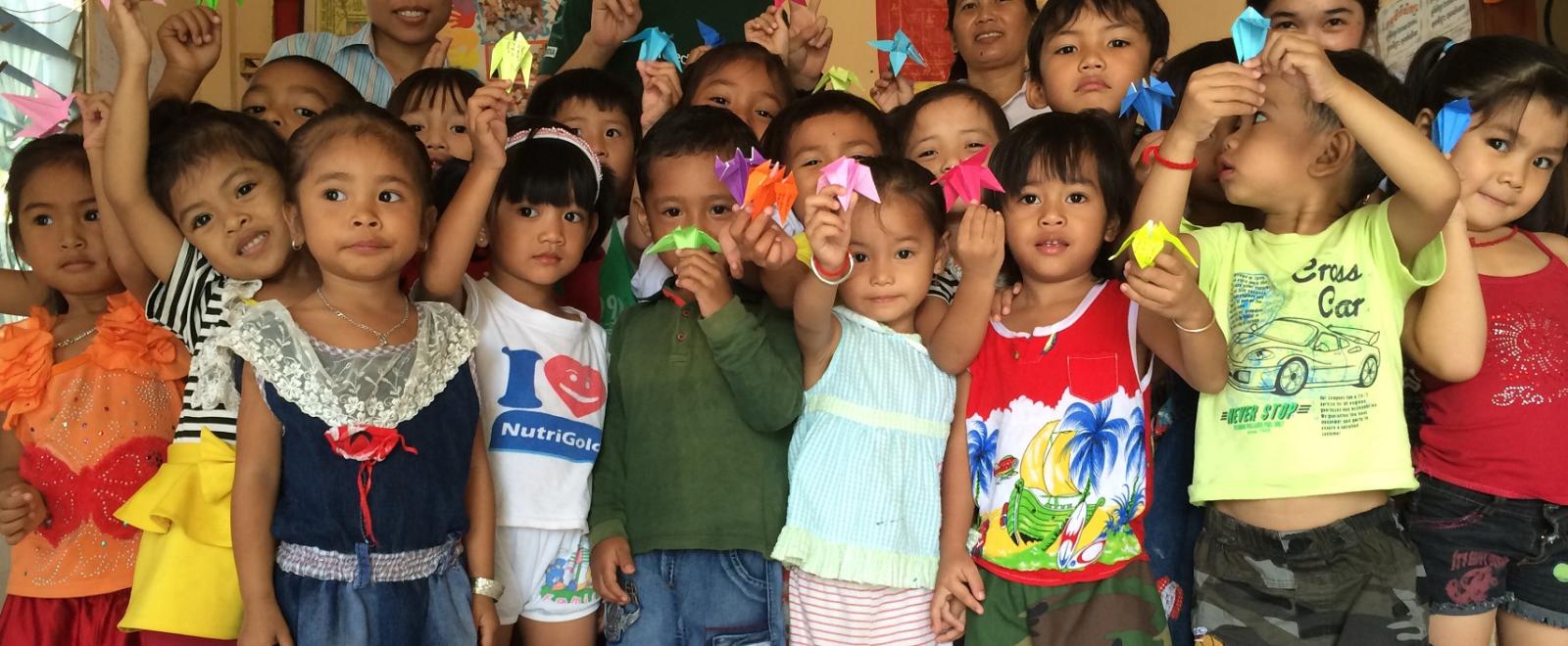 Project Abroad volunteers pose with children on the Childcare Project