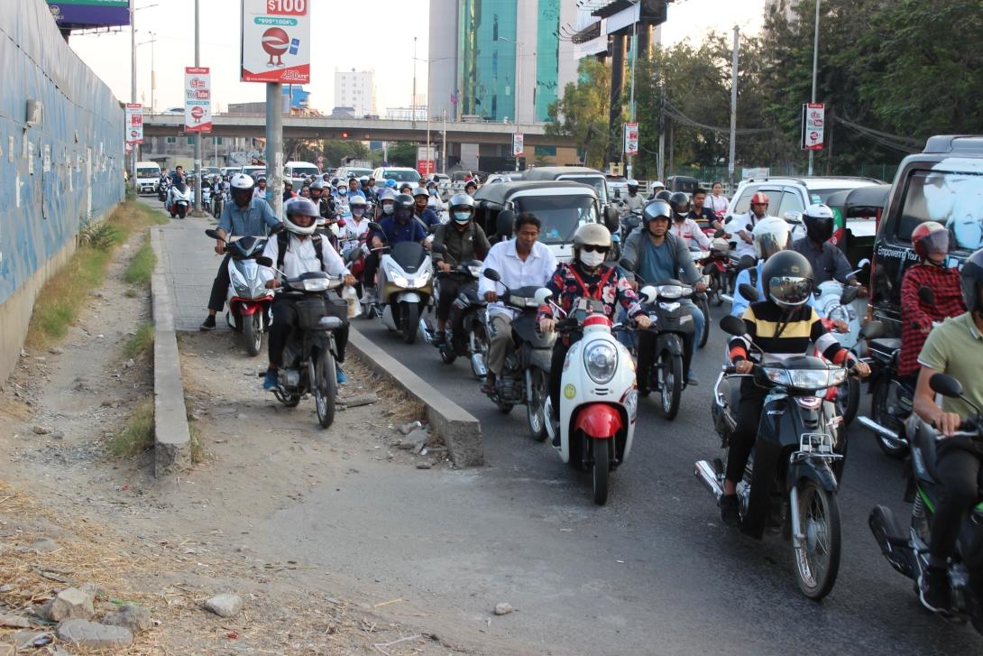 Various vehicles stuck in traffic in a road of Phnom Penh