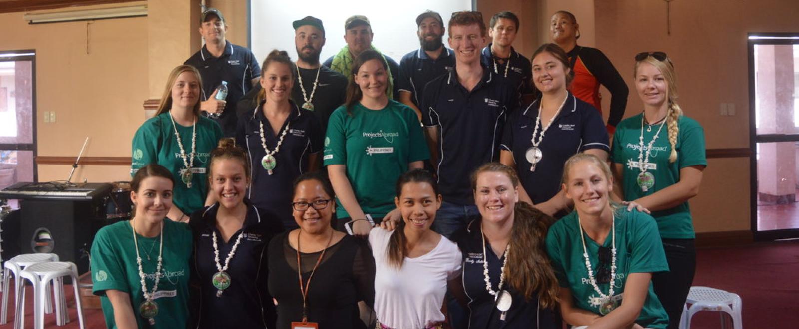 A group of university students volunteer at a community healthcare outreach in the Philippines. 