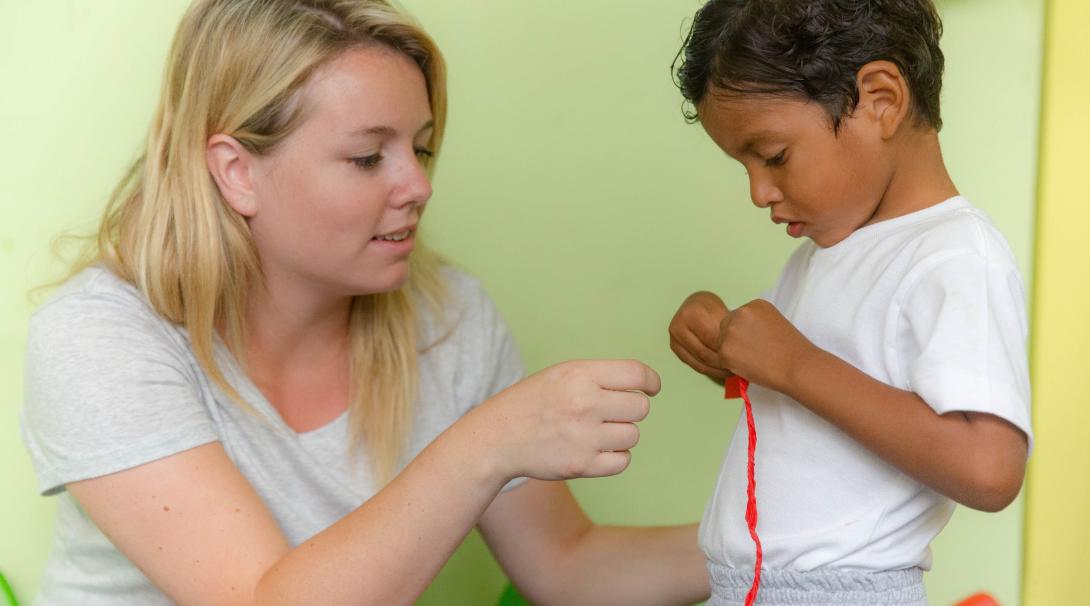 A volunteer on a gap semester program uses arts and crafts to teach Early Childhood Development skills in Ecuador.