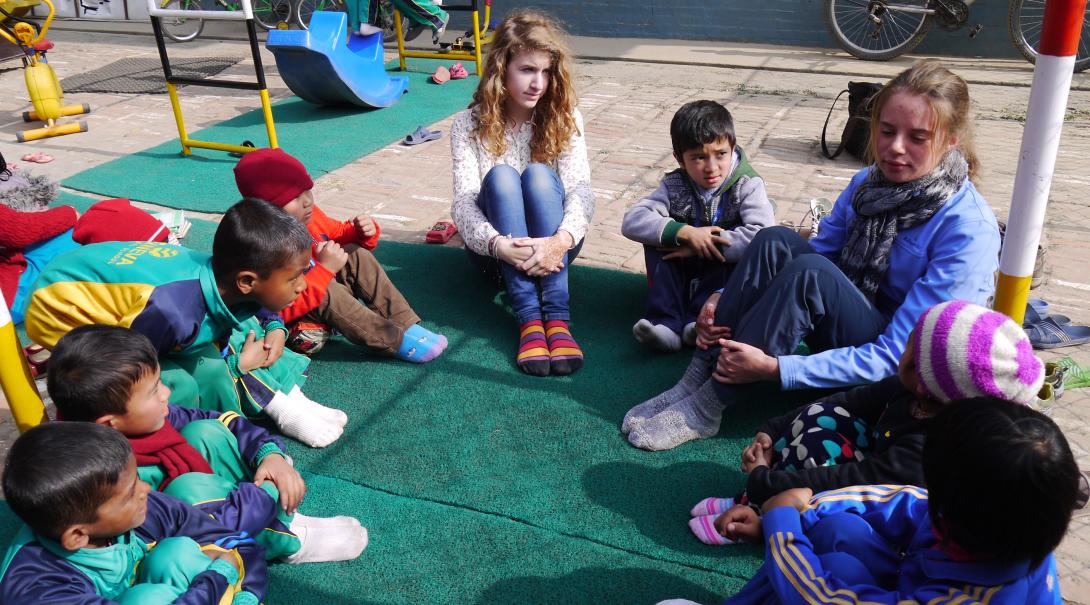 Childcare volunteers with children in Nepal