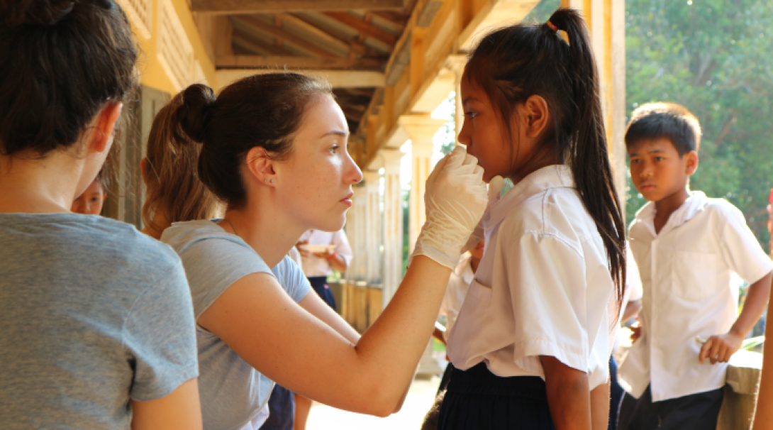 A volunteer conducts a health check